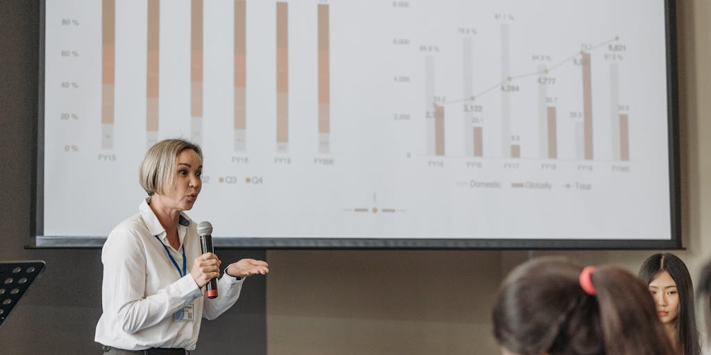 A split-screen image showing two different perspectives: one side features a speaker presenting a marketing webinar, while the other side shows a participant at home, engaged and taking notes. This visual contrast highlights the connection between the speaker and the audience, emphasizing the interactive nature of webinars.