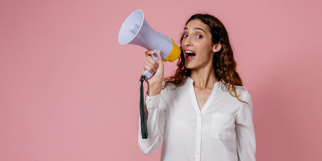 A dynamic image of a person standing in front of a large screen displaying both Facebook and Instagram logos. The person is pointing at the screen with a confident smile, symbolizing empowerment and ease in cross-posting. The background is filled with digital graphics representing connectivity.