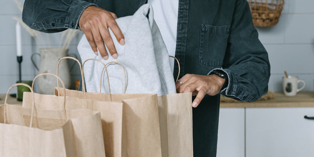 A creative split image showing a person shopping online on one side and a delivery person handing over a package on the other. This visual represents the seamless transition from browsing to receiving products, highlighting Lazada's efficient service.