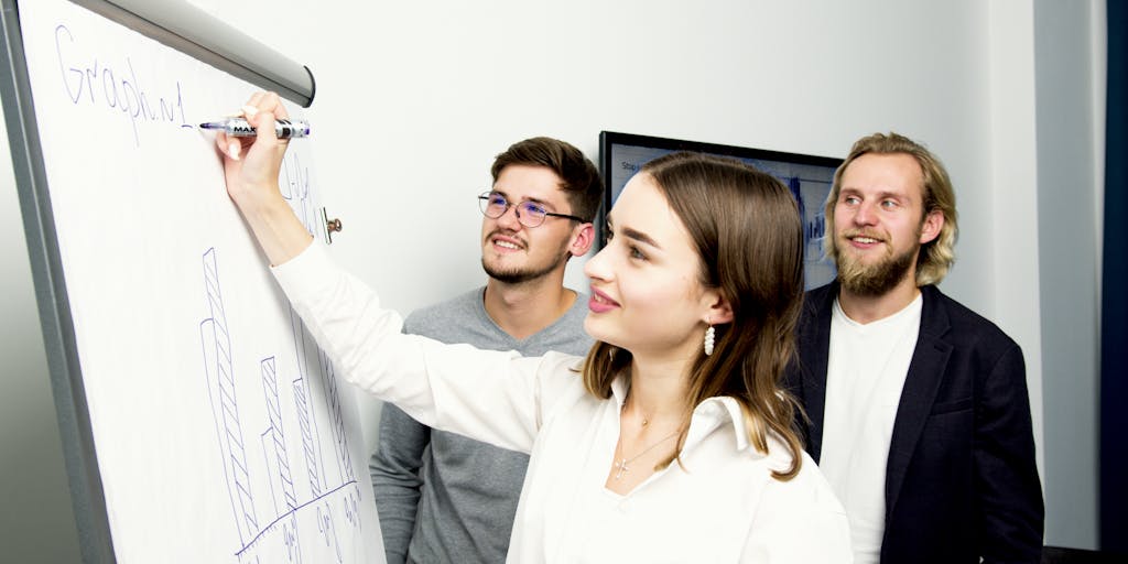 A conceptual image of a digital marketing funnel with Datadog branding, illustrated as a flowchart on a whiteboard. A marketer is seen explaining the funnel to a group, emphasizing the strategic approach to customer engagement.