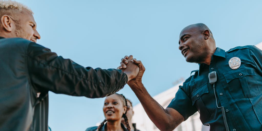 A dynamic image of AS Monaco players engaging with young fans during a community outreach event. The photo should capture the players signing autographs, taking selfies, and interacting with children, showcasing the club's commitment to community engagement and youth development as part of their marketing strategy.