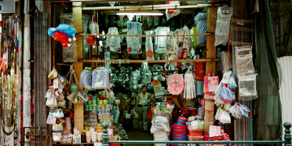 A close-up of a Kansas City Chiefs merchandise display in a local store, featuring jerseys, hats, and memorabilia. The photo should highlight the variety of products available for fans, showcasing the marketing strategy of engaging local businesses and promoting team spirit.