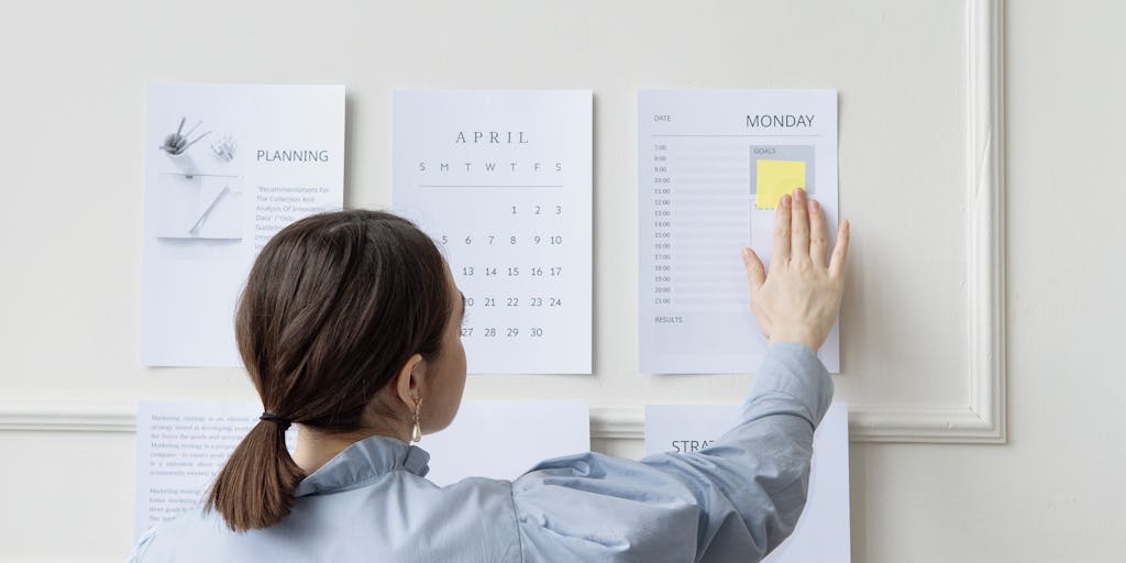 A creative flat lay of a pricing strategy meeting, featuring a whiteboard with pricing models sketched out, markers, and a smartphone displaying the Salesloft app. The image should capture the collaborative spirit of a team brainstorming.