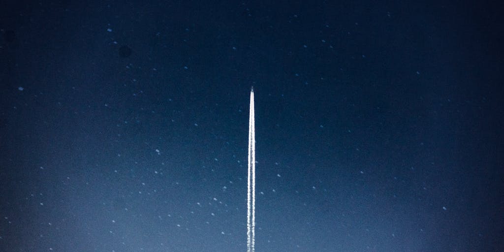 An infographic-style image that creatively combines elements of a rocket launch with pricing tags. The rocket is depicted taking off, with various pricing tiers illustrated as clouds in the sky, showcasing the concept of reaching new heights with Rocket Reach.