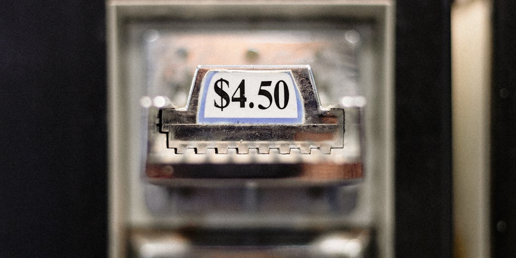 A conceptual image of a scale balancing a stack of coins on one side and an Evaboot product on the other, symbolizing value for money. The background is a blurred cityscape, suggesting the broader market context.