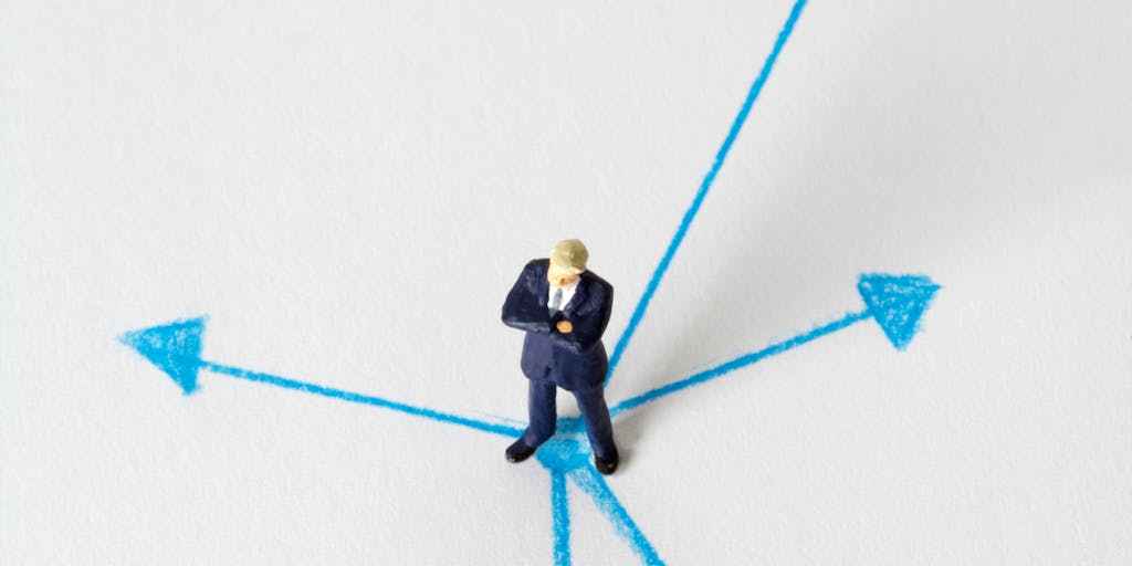 A conceptual image of a person standing at a crossroads with multiple signposts indicating different pricing options. The person looks contemplative, symbolizing the decision-making process involved in choosing the right pricing strategy.