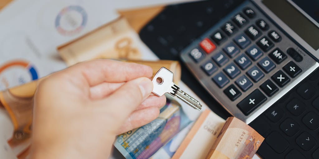 A creative flat lay of various currency notes and coins arranged in a way that forms a pie chart, symbolizing the concept of pricing. Each segment of the pie chart can represent different pricing tiers or strategies, showcasing the diversity in pricing models.
