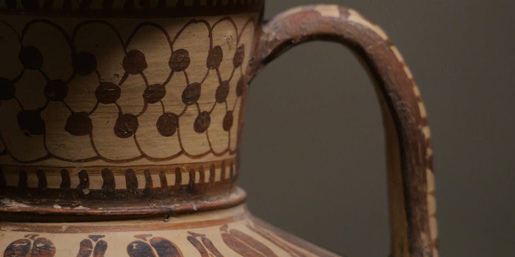 A split image showing a clay pot being crafted on one side and a digital screen displaying the pricing page of Clay.com on the other. This juxtaposition highlights the blend of traditional craftsmanship and modern pricing strategies.