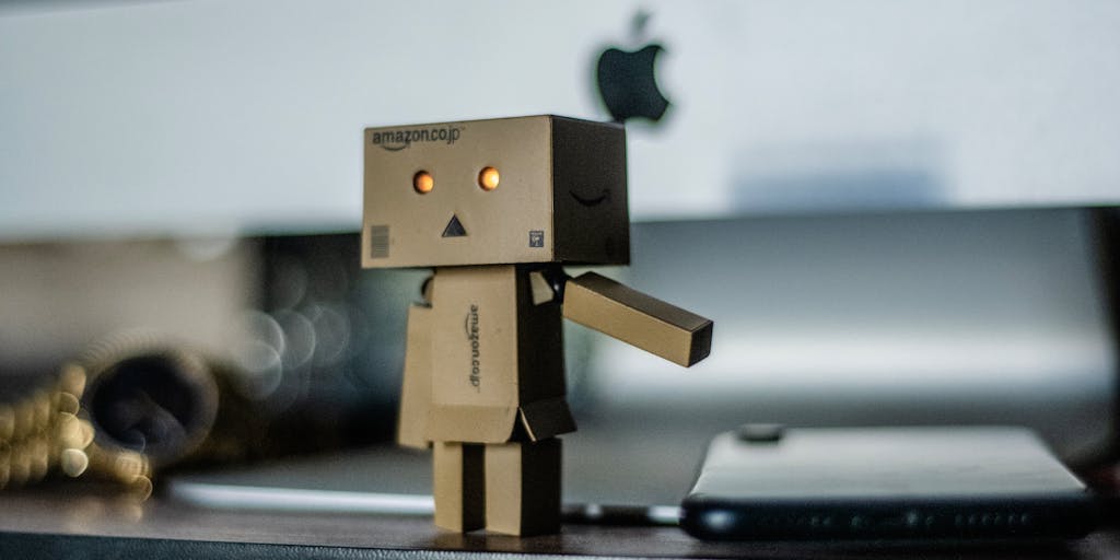 An artistic representation of a journalist sitting at a desk surrounded by floating icons representing various AI tools (like chatbots, data analytics, etc.). The journalist is looking thoughtfully at a notepad, symbolizing the integration of AI in the creative process of news reporting.