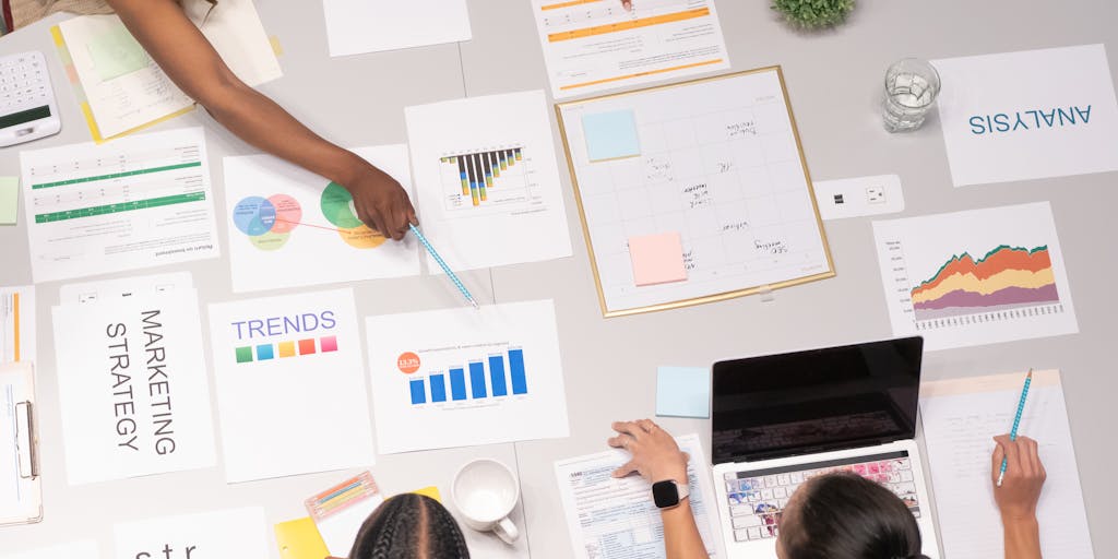 A split-screen image showing a person working on a laptop on one side, with a graph displaying rising SEO metrics on the other. The person looks focused and engaged, symbolizing the effectiveness of Outrank.so in improving search rankings.