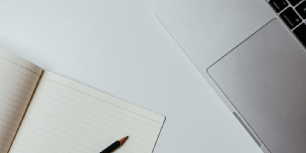 A split-screen image showing a person using a traditional word processor on one side and a modern AI writing assistant on the other. The left side is cluttered with papers and notes, while the right side is sleek and organized, showcasing a clean interface with suggestions popping up. The contrast highlights the evolution of writing tools.