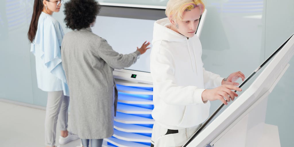 A futuristic workspace featuring a sleek, modern desk with a holographic display showing lines of text being generated in real-time. The background includes a window with a city skyline, symbolizing the blend of technology and creativity. Soft ambient lighting enhances the high-tech atmosphere.