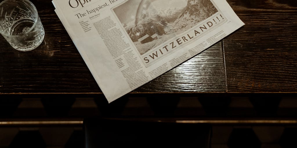 A whimsical scene depicting a newspaper office where journalists are frantically typing on typewriters, but instead of news articles, they are creating absurd headlines like 'Cats Take Over City Hall'. The office is cluttered with coffee cups, crumpled papers, and a large 'Fake News' banner hanging on the wall.