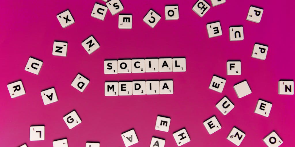 A vibrant, colorful beehive made of various social media icons, symbolizing the concept of a 'FeedHive Alternative'. The hive is surrounded by bees that represent different content creators, each carrying a piece of content like a flower. The background is a bright blue sky with fluffy clouds, emphasizing creativity and collaboration.