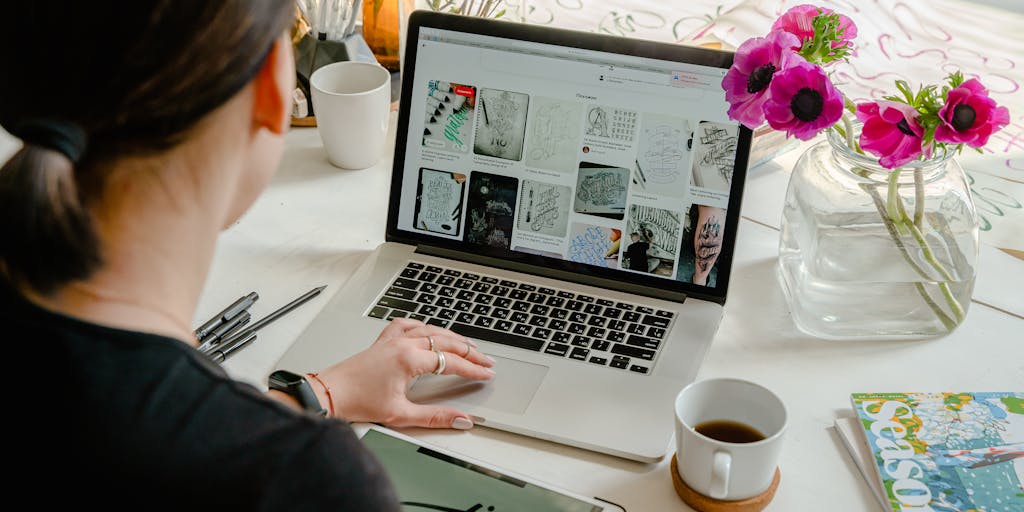 A split-screen image showing two different workspaces: on one side, a person using Publer on a sleek laptop with colorful charts and social media icons in the background; on the other side, another person using FeedHive on a tablet with a buzzing hive graphic and vibrant social media notifications. The contrast highlights the unique features of each platform.