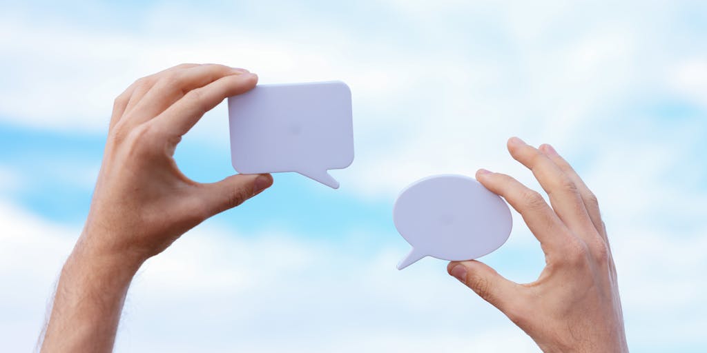 A whimsical scene depicting a friendly debate between two cartoon characters, one representing Publer and the other Agorapulse. They are standing on a stage with a microphone, surrounded by an audience of social media icons, each character passionately presenting their platform's strengths in a fun and engaging way.