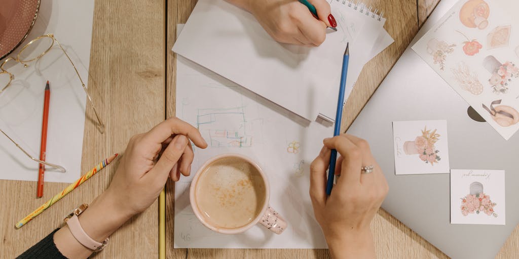 An overhead shot of two coffee cups on a table, each labeled with 'Buffer' and 'SocialBee'. Between the cups, there are scattered sticky notes with social media strategies and ideas. The warm lighting creates a cozy atmosphere, symbolizing the brainstorming process behind social media management.