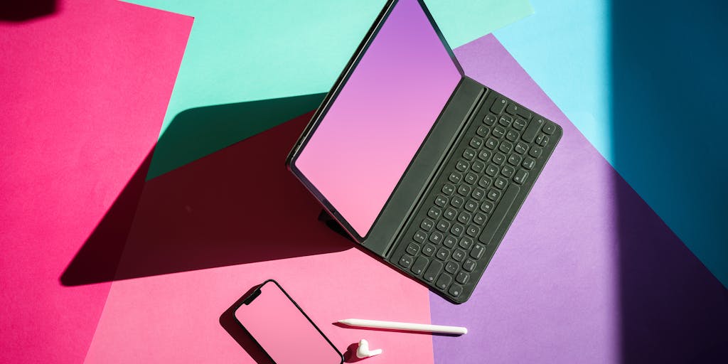 A split-screen image showing two desks side by side. On one side, a person is using SocialBee with a vibrant, colorful interface on their computer screen, surrounded by plants and motivational quotes. On the other side, a person is using Vista Social with a sleek, modern setup, featuring a minimalist design and tech gadgets. The contrasting environments highlight the different vibes of each platform.